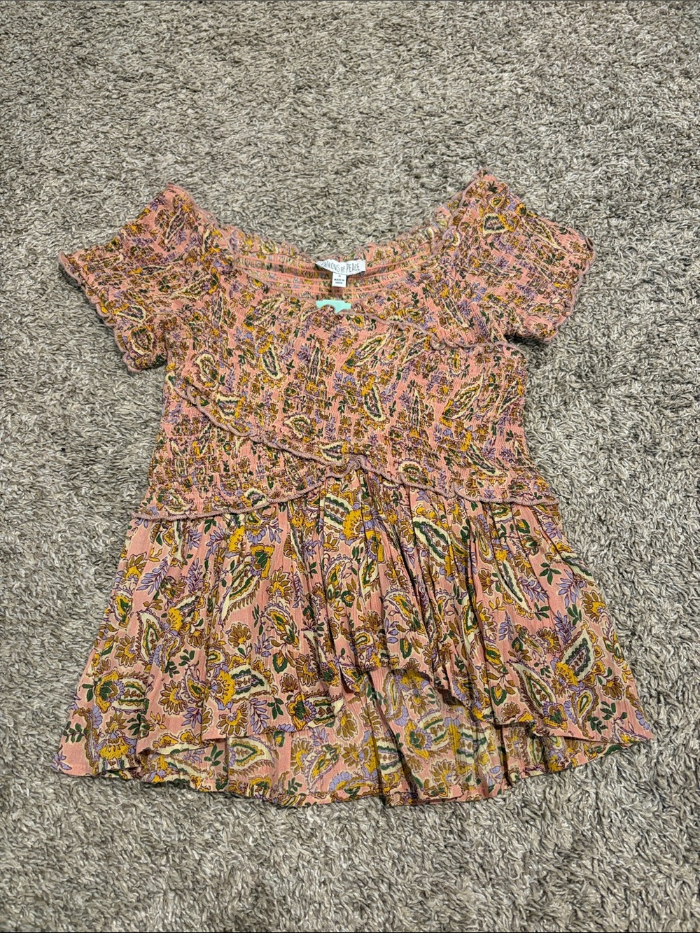 Patrons of Peace Smocked Top